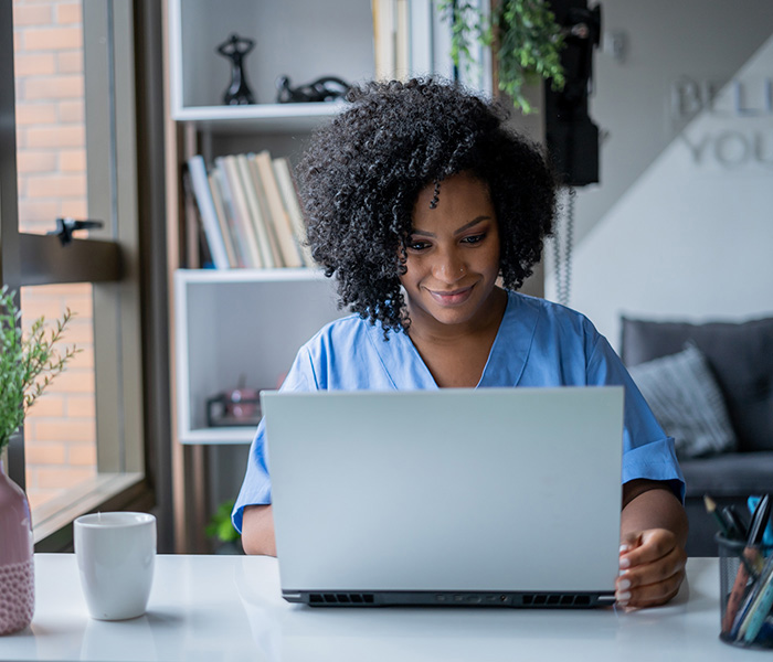 Health Information student at a computer